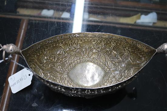 An Indian? white metal oval bowl with ring handles and three other items including two filligree items.